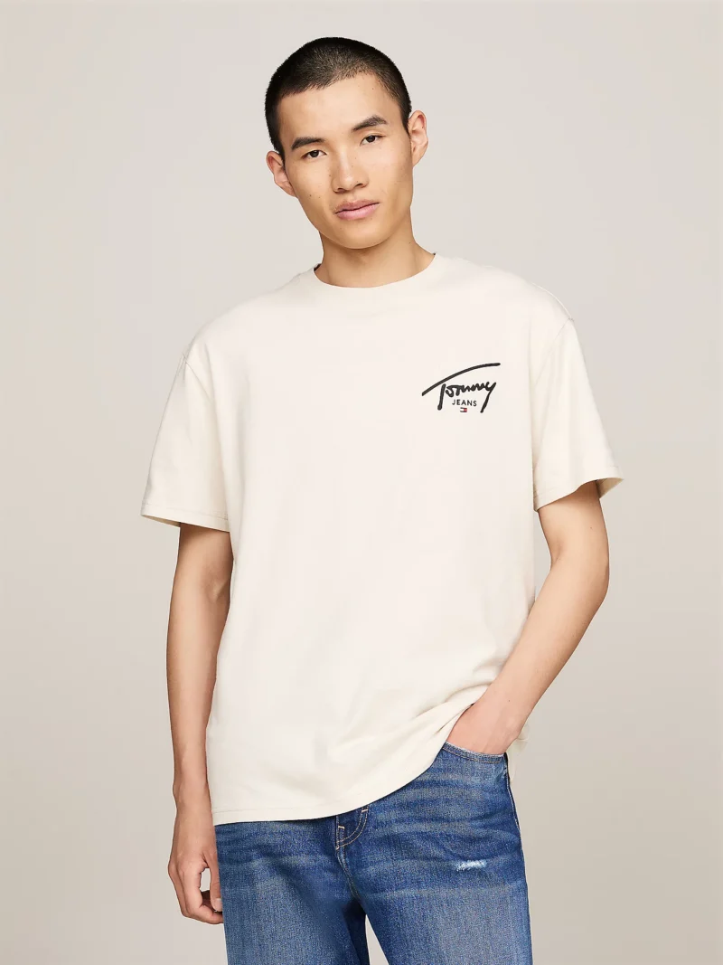DM0DM18536_ACG_main TOMMY HILFIGER - T-shirt con logo firma - Bianco